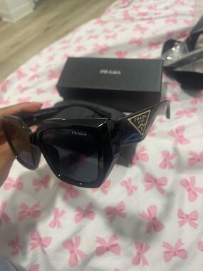 Prada Black Cat-Eye Sunglasses with Gold Triangle Logo